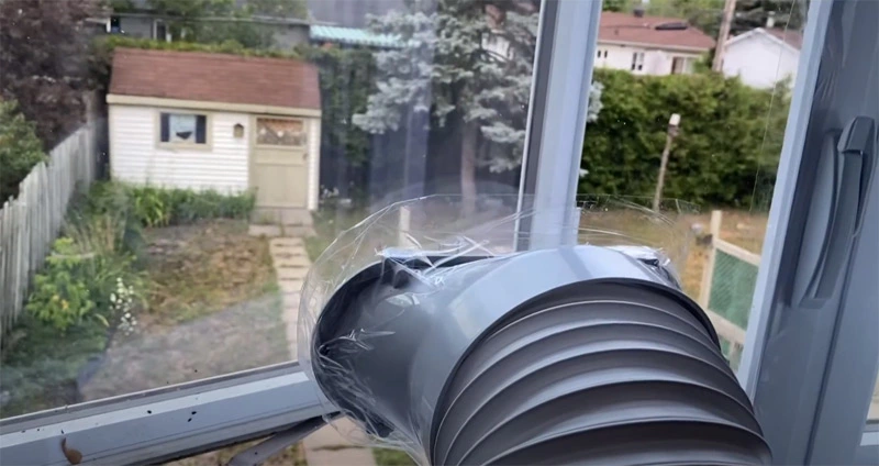 Steps for installing a portable air conditioner in a push out window