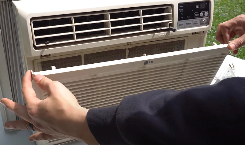 Steps to follow to remove the front cover of window air conditioning unit